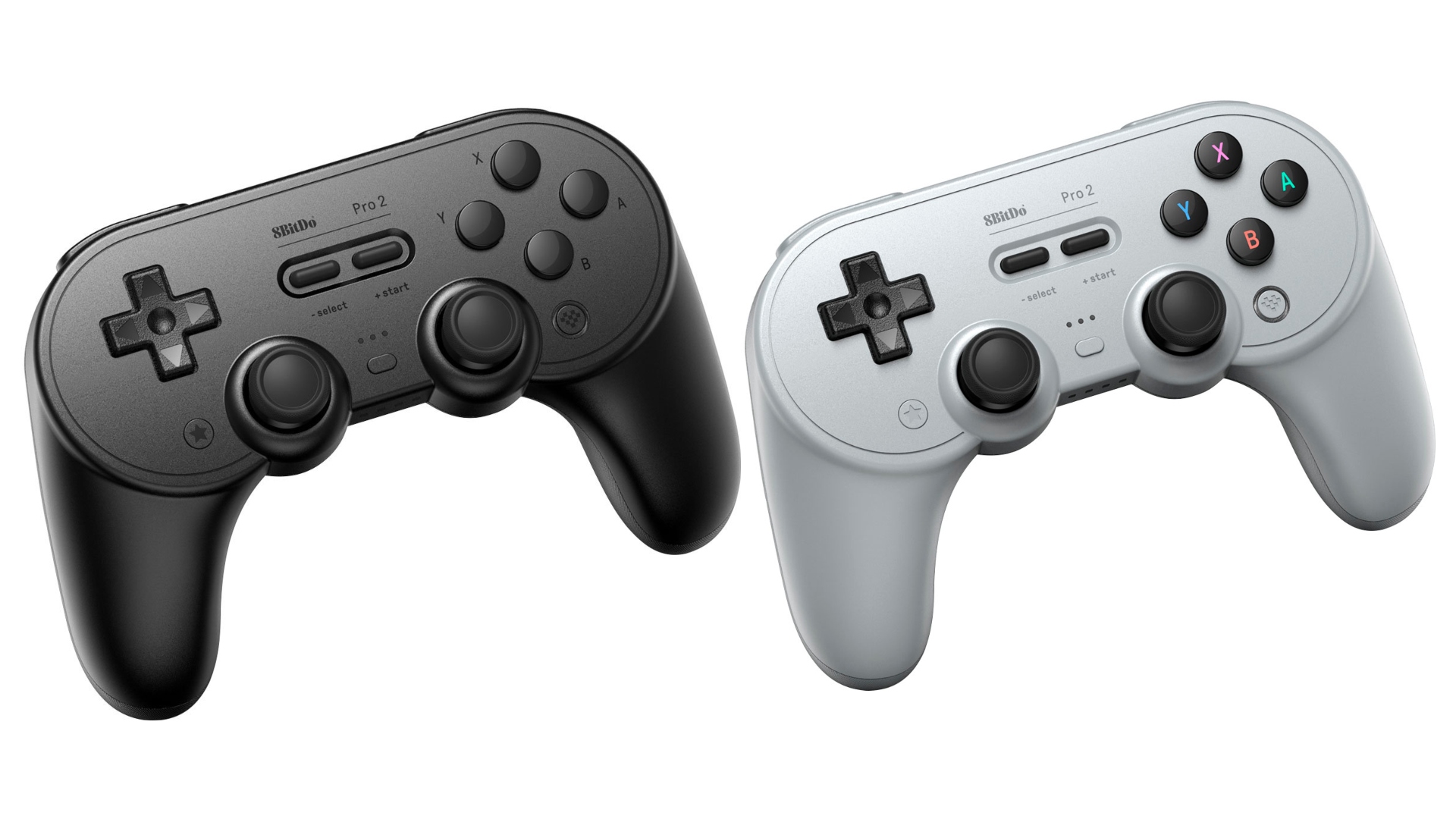 Nintendo Switch controller drifting? Try the 8bitdo, pictured. Image shows two mildly SNES-esque controllers side by side, one black and one grey.